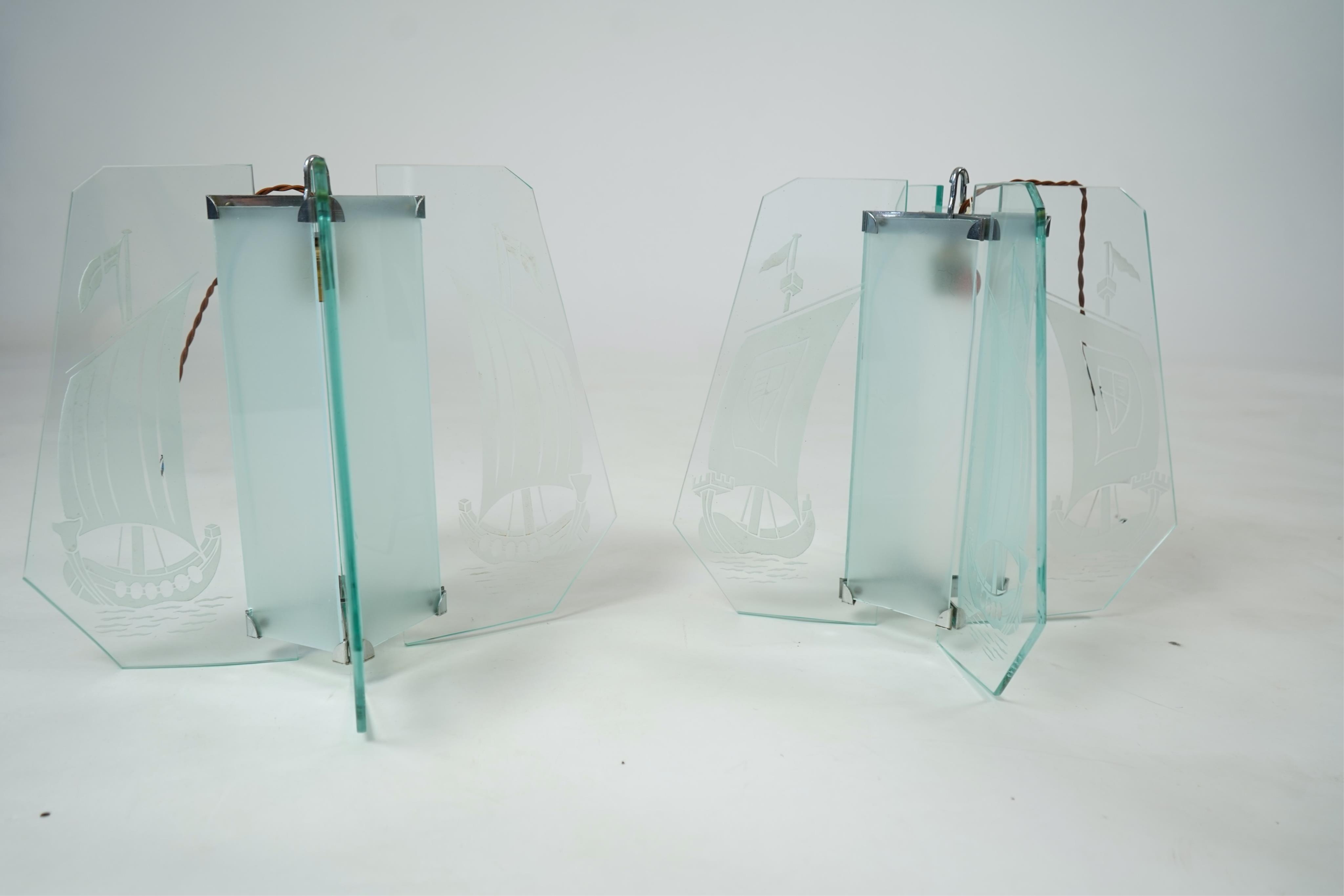 A pair of Art Deco chrome and four panelled etched glass ‘Galleon’ designed celling pendant lights